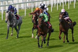 ESHER, ENGLAND - JULY 02: Jason Watson riding Vino Victrix (green) win The Davies Group Handicap at Sandown Racecourse on July 02, 2021 in Esher, England. Due to the Coronavirus pandemic, only owners along with a limited number of the paying public will be allowed to attend the meeting. (Photo by Alan Crowhurst/Getty Images)