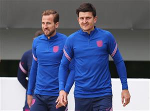 BURTON UPON TRENT, ENGLAND - JULY 02: Harry Kane and Harry Maguire of England walk out prior to the England Training Session at St George's Park on July 02, 2021 in Burton upon Trent, England. (Getty Images)