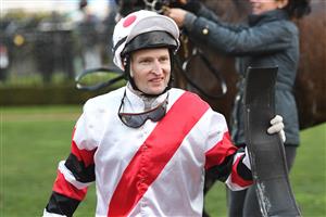 MELBOURNE, AUSTRALIA - JULY 03: Craig Newitt after riding Lindhout to win Race 9, the Tcl Leilani Series Final, during Melbourne Racing at Flemington Racecourse on July 03, 2021 in Melbourne, Australia. (Photo by Vince Caligiuri/Getty Images)
