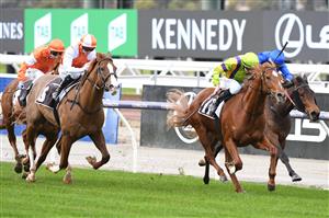 MELBOURNE, AUSTRALIA - JULY 03: Damian Lane riding Jagar winning Race 1, the Sofitel Next Generation Sprinters Final, during Melbourne Racing at Flemington Racecourse on July 03, 2021 in Melbourne, Australia. (Photo by Vince Caligiuri/Getty Images)
