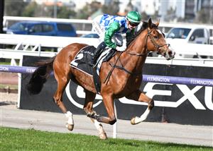 MELBOURNE, AUSTRALIA - JULY 03: Jamie Kah riding Grand Promenade winning Race 3, the Lexus Banjo Paterson Series Final, during Melbourne Racing at Flemington Racecourse on July 03, 2021 in Melbourne, Australia. (Photo by Vince Caligiuri/Getty Images)