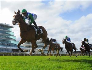 MELBOURNE, AUSTRALIA - JULY 03: Jamie Kah riding Grand Promenade winning Race 3, the Lexus Banjo Paterson Series Final, during Melbourne Racing at Flemington Racecourse on July 03, 2021 in Melbourne, Australia. (Photo by Vince Caligiuri/Getty Images)