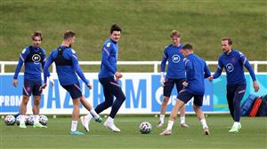 BURTON UPON TRENT, ENGLAND - JULY 05: Jordan Henderson of England passes the ball to teammate Kieran Trippier as Harry Maguire watches on during the England Training Session at St George's Park on July 05, 2021 in Burton upon Trent, England. (Getty Images)