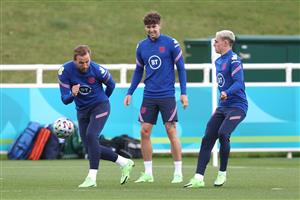BURTON UPON TRENT, ENGLAND - JULY 05: Harry Kane of England controls the ball as teammates John Stones and Phil Foden watch on during the England Training Session at St George's Park on July 05, 2021 in Burton upon Trent, England. (Getty Images)