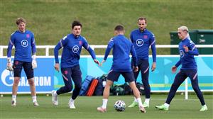 BURTON UPON TRENT, ENGLAND - JULY 05: Kieran Trippier of England controls the ball as Harry Maguire, Harry Kane and Phil Foden watch on during the England Training Session at St George's Park on July 05, 2021 in Burton upon Trent, England. (Getty Images)