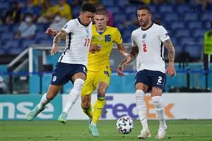 Ukraine's defender Vitaliy Mykolenko (C) vies for the ball with England's forward Jadon Sancho (L) during the UEFA EURO 2020 quarter-final football match between Ukraine and England at the Olympic Stadium in Rome on July 3, 2021. (Getty Images)