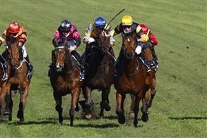 SYDNEY, AUSTRALIA - JULY 03: Tommy Berry on Our Bellagio Miss (yellow/black) wins race 5 the Midway Handicap during Sydney Racing at Rosehill Gardens on July 03, 2021 in Sydney, Australia. (Photo by Mark Evans/Getty Images)