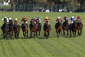 SYDNEY, AUSTRALIA - JULY 03: Tommy Berry on Our Bellagio Miss (yellow/black) wins race 5 the Midway Handicap during Sydney Racing at Rosehill Gardens on July 03, 2021 in Sydney, Australia. (Photo by Mark Evans/Getty Images)