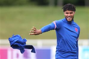 BURTON UPON TRENT, ENGLAND - JULY 06: Tyrone Mings of England throws a training top during the England Training Session at St George's Park on July 06, 2021 in Burton upon Trent, England. (Getty Images)