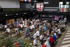 LONDON, ENGLAND - JULY 07: England fans at tables in Boxpark Wembley on July 07, 2021 in London, England. England has reached the semi-finals of the UEFA European Football Championship 2020 hoping to make the final for the first time in the history of the competition. (Getty Images)