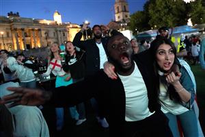 England supporters react as they watch the UEFA EURO 2020 semi-final football match between England and Denmark, at a fanzone in Trafalgar square, central London on July 7, 2021. (Getty Images)