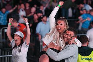England supporters react as they watch the UEFA EURO 2020 semi-final football match between England and Denmark, at a fanzone in Trafalgar square, central London on July 7, 2021. (Getty Images)