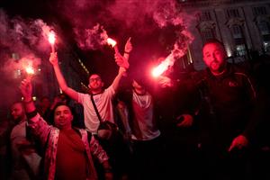 England supporters light flares as they celebrate victory following the UEFA EURO 2020 semi-final football match between England and Denmark, in Piccadilly, central London on July 7, 2021. (Getty Images)