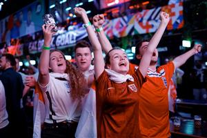 England supporters celebrate victory at the final whistle of the UEFA EURO 2020 semi-final football match between England and Denmark, at Boxpark Croydon in south London on July 7, 2021. (Getty Images)