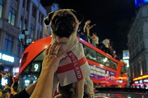England supporters celebrate victory following the UEFA EURO 2020 semi-final football match between England and Denmark, in central London on July 7, 2021. (Getty Images)