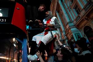 England supporters celebrate victory following the UEFA EURO 2020 semi-final football match between England and Denmark, in central London on July 7, 2021. (Getty Images)
