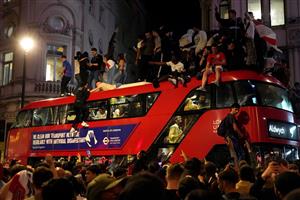 England supporters celebrate victory following the UEFA EURO 2020 semi-final football match between England and Denmark, in central London on July 7, 2021. (Getty Images)