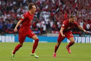 TOPSHOT - Denmark's forward Mikkel Damsgaard (L) runs to celebrate after scoring the first goal during the UEFA EURO 2020 semi-final football match between England and Denmark at Wembley Stadium in London on July 7, 2021. (Getty Images)