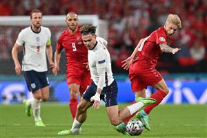 Denmark's defender Daniel Wass (R) fouls England's midfielder Jack Grealish (C) during the UEFA EURO 2020 semi-final football match between England and Denmark at Wembley Stadium in London on July 7, 2021. (Getty Images)