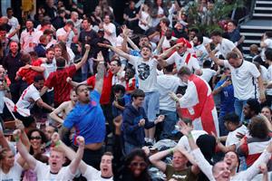 England supporters react as they watch the UEFA EURO 2020 semi-final football match between England and Denmark, at a fanzone in Trafalgar square, central London on July 7, 2021. (Getty Images)
