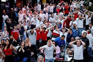 England supporters watch the UEFA EURO 2020 semi-final football match between England and Denmark, at Boxpark Croydon in south London on July 7, 2021. (Getty Images)