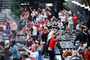 England supporters react as they watch the UEFA EURO 2020 semi-final football match between England and Denmark, at a fanzone in Trafalgar square, central London on July 7, 2021. (Getty Images)