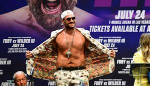 Boxer Tyson Fury arrives for press conference with Deontay Wilder (off frame) on June 15, 2021 in Los Angeles, California to announce their third WBC heavyweight championship ficght scheduled for July 24 in Las Vegas. (Getty Images)