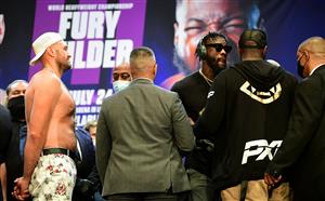 Boxer Tyson Fury (L) looks on as Deontay Wilder turns away following a long face-off on June 15, 2021 in Los Angeles, California at a press conference to announce their third WBC heavyweight championship ficght scheduled for July 24 in Las Vegas. (Getty Images)
