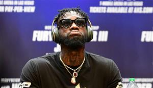 TOPSHOT - Boxer Deontay Wilder kept his headphones on and took no questions during a press conference with Tyson Fury (off frame) on June 15, 2021 in Los Angeles, California to announce their third WBC heavyweight championship fight scheduled for July 24 in Las Vegas. (Getty Images)