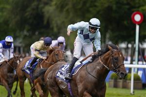 NEWMARKET, ENGLAND - JULY 10: Tom Marquand riding Starman celebrates as he crosses the line to win The Darley July Cup Stakes at Newmarket Racecourse on July 10, 2021 in Newmarket, England. Due to the Coronavirus pandemic, only owners along with a limited number of the paying public will be allowed to attend the meeting. (Photo by Alan Crowhurst/Getty Images)