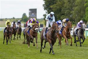 NEWMARKET, ENGLAND - JULY 10: Tom Marquand riding Starman celebrates as he crosses the line to win The Darley July Cup Stakes at Newmarket Racecourse on July 10, 2021 in Newmarket, England. Due to the Coronavirus pandemic, only owners along with a limited number of the paying public will be allowed to attend the meeting. (Photo by Alan Crowhurst/Getty Images)
