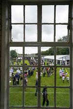 NEWMARKET, ENGLAND - JULY 10: A general view as jockeys make their way to the parade ring at Newmarket Racecourse on July 10, 2021 in Newmarket, England. Due to the Coronavirus pandemic, only owners along with a limited number of the paying public will be allowed to attend the meeting. (Photo by Alan Crowhurst/Getty Images)