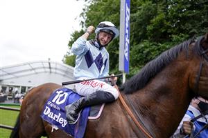 NEWMARKET, ENGLAND - JULY 10: Tom Marquand riding Starman celebrates after winning The Darley July Cup Stakes at Newmarket Racecourse on July 10, 2021 in Newmarket, England. Due to the Coronavirus pandemic, only owners along with a limited number of the paying public will be allowed to attend the meeting. (Photo by Alan Crowhurst/Getty Images)
