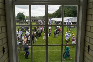 NEWMARKET, ENGLAND - JULY 10: A general view as jockeys make their way to the parade ring at Newmarket Racecourse on July 10, 2021 in Newmarket, England. Due to the Coronavirus pandemic, only owners along with a limited number of the paying public will be allowed to attend the meeting. (Photo by Alan Crowhurst/Getty Images)