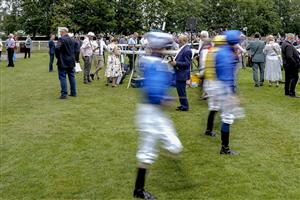 NEWMARKET, ENGLAND - JULY 10: A general view as jockeys make their way to the parade ring at Newmarket Racecourse on July 10, 2021 in Newmarket, England. Due to the Coronavirus pandemic, only owners along with a limited number of the paying public will be allowed to attend the meeting. (Photo by Alan Crowhurst/Getty Images)