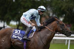 NEWMARKET, ENGLAND - JULY 10: Tom Marquand riding Starman celebrates as he crosses the line to win The Darley July Cup Stakes at Newmarket Racecourse on July 10, 2021 in Newmarket, England. Due to the Coronavirus pandemic, only owners along with a limited number of the paying public will be allowed to attend the meeting. (Photo by Alan Crowhurst/Getty Images)