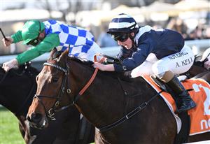 MELBOURNE, AUSTRALIA - JULY 10: Alana Kelly riding Falls winning race 5, the Mrc Membership Renewal Handicap, during Melbourne Racing at Caulfield Racecourse on July 10, 2021 in Melbourne, Australia. (Photo by Vince Caligiuri/Getty Images)