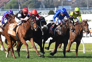 MELBOURNE, AUSTRALIA - JULY 10: Billy Egan riding Libiamo winning Race 1, the Neds Handicap, during Melbourne Racing at Caulfield Racecourse on July 10, 2021 in Melbourne, Australia. (Photo by Vince Caligiuri/Getty Images)