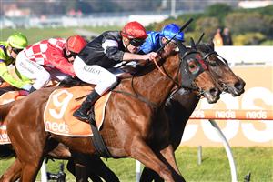 MELBOURNE, AUSTRALIA - JULY 10: Billy Egan riding Libiamo winning Race 1, the Neds Handicap, during Melbourne Racing at Caulfield Racecourse on July 10, 2021 in Melbourne, Australia. (Photo by Vince Caligiuri/Getty Images)