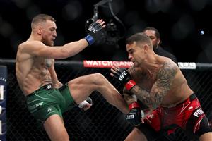 LAS VEGAS, NEVADA - JULY 10: Conor McGregor of Ireland (L) attempts a kick against Dustin Poirier in the first round in their lightweight bout during UFC 264: Poirier v McGregor 3 at T-Mobile Arena on July 10, 2021 in Las Vegas, Nevada. (Getty Images)