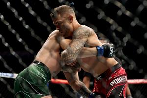 LAS VEGAS, NEVADA - JULY 10: Conor McGregor of Ireland (L) and Dustin Poirier grapple in the first round in their lightweight bout during UFC 264: Poirier v McGregor 3 at T-Mobile Arena on July 10, 2021 in Las Vegas, Nevada. (Getty Images)