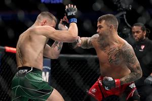 LAS VEGAS, NEVADA - JULY 10: Conor McGregor of Ireland (L) and Dustin Poirier exchange blows in the first round in their lightweight bout during UFC 264: Poirier v McGregor 3 at T-Mobile Arena on July 10, 2021 in Las Vegas, Nevada. (Getty Images)