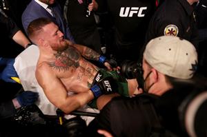LAS VEGAS, NEVADA - JULY 10: Conor McGregor of Ireland is carried out of the arena on a stretcher after injuring his ankle in the first round of his lightweight bout against Dustin Poirier during UFC 264: Poirier v McGregor 3 at T-Mobile Arena on July 10, 2021 in Las Vegas, Nevada. (Getty Images)