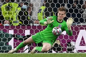 TOPSHOT - England's goalkeeper Jordan Pickford saves a shot by Italy's forward Andrea Belotti in the penalty shootout during the UEFA EURO 2020 final football match between Italy and England at the Wembley Stadium in London on July 11, 2021. (Getty Images)