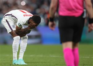 England's forward Marcus Rashford (L) reacts after failing to score in the penalty shootout during the UEFA EURO 2020 final football match between Italy and England at the Wembley Stadium in London on July 11, 2021. (Getty Images)