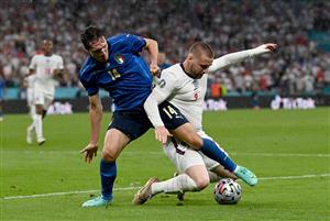 LONDON, ENGLAND - JULY 11: Luke Shaw of England is challenged by Federico Chiesa of Italy during the UEFA Euro 2020 Championship Final between Italy and England at Wembley Stadium on July 11, 2021 in London, England. (Getty Images)