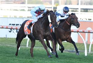 MELBOURNE, AUSTRALIA - JULY 10: Ben Melham riding Red Can Man defeats Jamie Kah riding Malkovich in Race 8, the Neds Sir John Monash Stakes, during Melbourne Racing at Caulfield Racecourse on July 10, 2021 in Melbourne, Australia. (Photo by Vince Caligiuri/Getty Images)