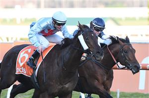 MELBOURNE, AUSTRALIA - JULY 10: Ben Melham riding Red Can Man defeats Jamie Kah riding Malkovich in Race 8, the Neds Sir John Monash Stakes, during Melbourne Racing at Caulfield Racecourse on July 10, 2021 in Melbourne, Australia. (Photo by Vince Caligiuri/Getty Images)