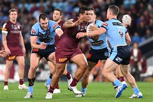 GOLD COAST, AUSTRALIA - JULY 14: Moeaki Fotuaika of the Maroons is tackled during game three of the 2021 State of Origin Series between the New South Wales Blues and the Queensland Maroons at Cbus Super Stadium on July 14, 2021 in Gold Coast, Australia. (Photo by Bradley Kanaris/Getty Images)
