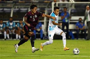 DALLAS, TEXAS - JULY 14: Carlos Salcedo #3 of Mexico and Robin Betancourth #18 of Guatemala fight for the ball in the first half at Cotton Bowl on July 14, 2021 in Dallas, Texas. (Getty Images)